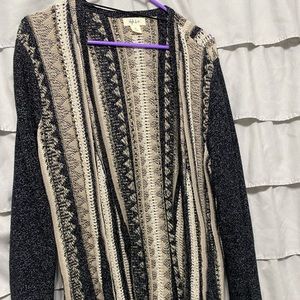 Brand new cardigan, never worn, no tags, covers buttocks